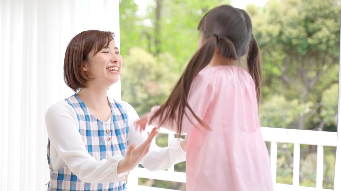 young asian girl playing with childminder